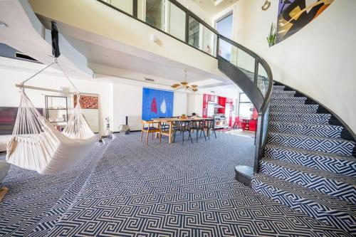 a room with a swinging hammock and a dining room at Private Gramercy TownHouse 3BR 3BA with Terrace in New York