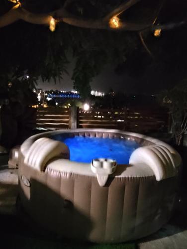 a large pool with blue water at night at BE BLUE GREEN in Fort-de-France