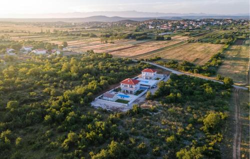 an aerial view of a large white house with a red roof at Villa Magdalena in Polača