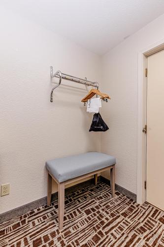 a bench sitting in a room with a wall at Rivers Edge Motel in Cherokee