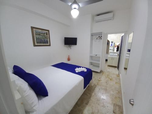 Ένα ή περισσότερα κρεβάτια σε δωμάτιο στο Hotel Casa Olga