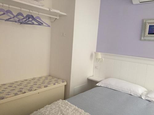 a small room with two beds in it at La Linea D'Acqua in Manarola