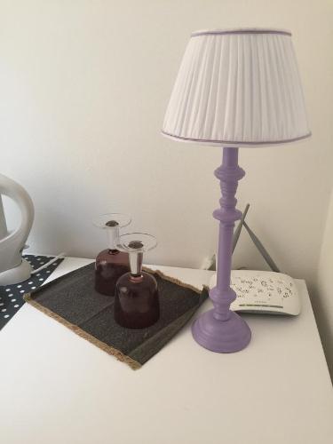 a lamp sitting on a table next to ainylinylinylinylinylinylinyl at La Linea D'Acqua in Manarola