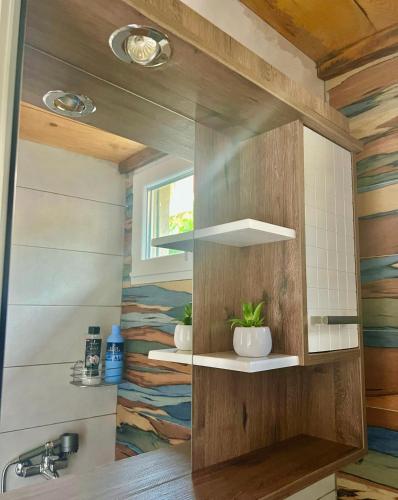a bathroom with a sink and a mirror at Apartments Stella in Virpazar