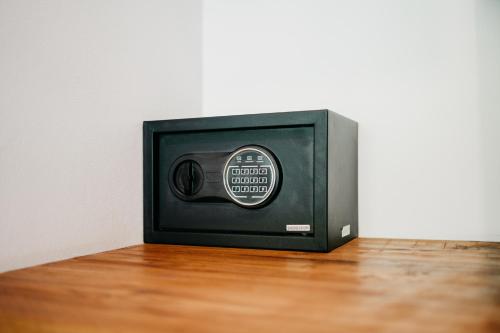 a small television sitting on top of a wooden floor at Travel Room Lipah Beach in Amed