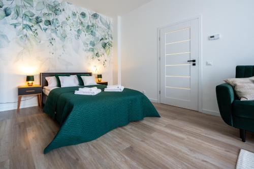 Ένα ή περισσότερα κρεβάτια σε δωμάτιο στο Green Apartment