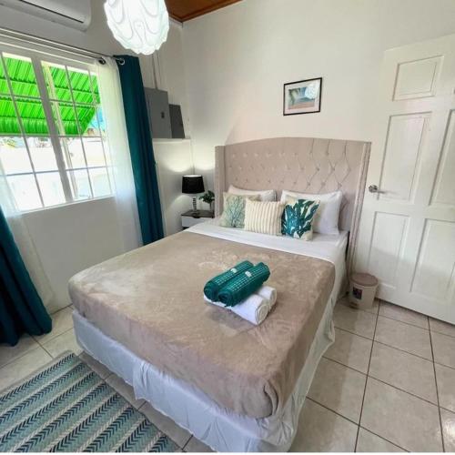 a bedroom with a large bed with towels on it at The ARC in Scarborough