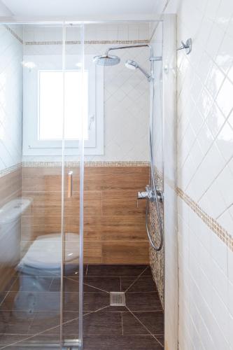 a shower with a glass door in a bathroom at Calas Beach Corralejo in Corralejo