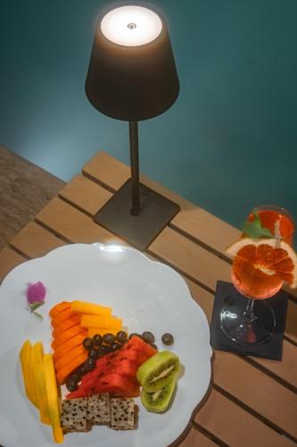a plate of fruit and vegetables on a table at Hotel Casa Don Luis by Faranda Boutique, a member of Radisson Individuals in Cartagena de Indias
