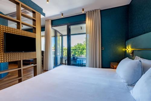 Un pat sau paturi într-o cameră la Armagrandi Spina Hotel-Special Category