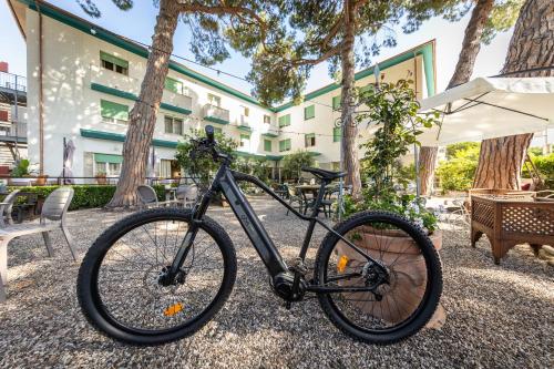a bike parked in front of a building at Hotel Massimo in Marina di Cecina