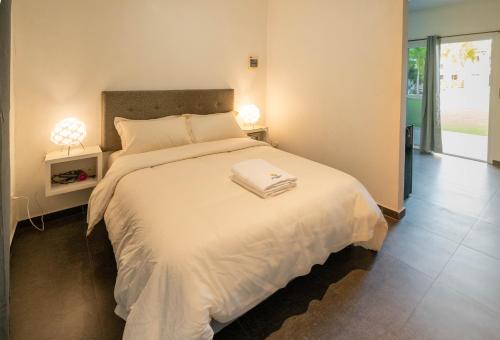 Ένα ή περισσότερα κρεβάτια σε δωμάτιο στο Malinawon Resort 馬莉吶灣度假中心