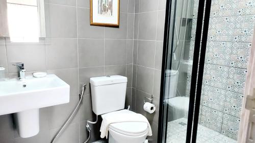 a bathroom with a toilet and a sink and a shower at Hua Hin La Casita Beautiful Two Bedroom Condo With Great Views in Hua Hin