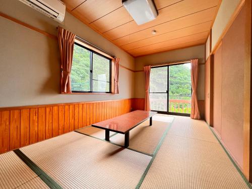 Ένα ή περισσότερα κρεβάτια σε δωμάτιο στο 海辺のスパイスヴィラ　Ｃｏｙａｍａｒｉｓ