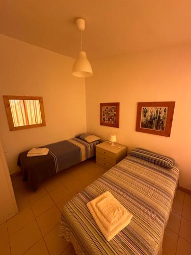 Postel nebo postele na pokoji v ubytování Casa dei gelsomini