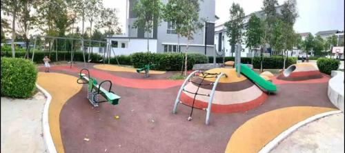 a park with a playground with slides and swings at MoonLight Sweet Home Kuala Selangor 30pax karaoke in Kuala Selangor