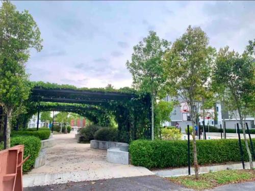 an archway in a park with trees and bushes at MoonLight Sweet Home Kuala Selangor 30pax karaoke in Kuala Selangor