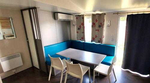 a small dining room with a table and chairs at Camping Prima in Týn nad Vltavou