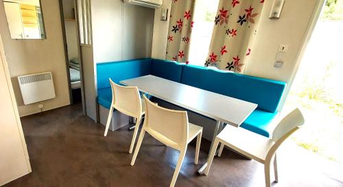 a dining room with a table and chairs at Camping Prima in Týn nad Vltavou
