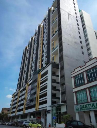 a tall building with cars parked in front of it at The Majestic Imperial Tower Premium Suite - Ipoh in Ipoh
