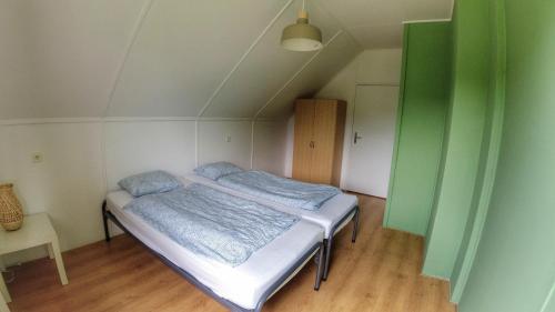 a small bedroom with a bed in a room at Camping Prima in Týn nad Vltavou