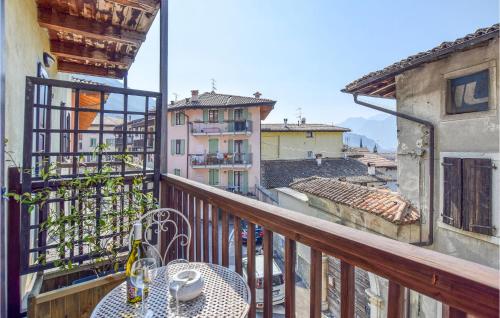 a balcony with a table and a view of a city at Nice Apartment In Vignole With Wifi in Arco