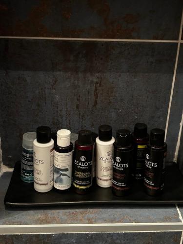 a black shelf with several differentiatesiatesiatesiatesiatesktop at George luxury living in Preveza