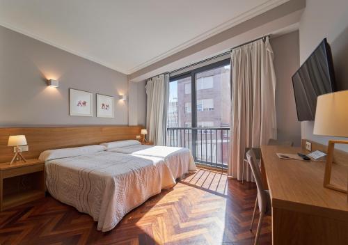 Ένα ή περισσότερα κρεβάτια σε δωμάτιο στο Hotel Prado Viejo