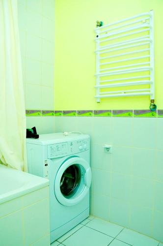 a washer and dryer in a small bathroom at Apartments on Independence Square in Kyiv