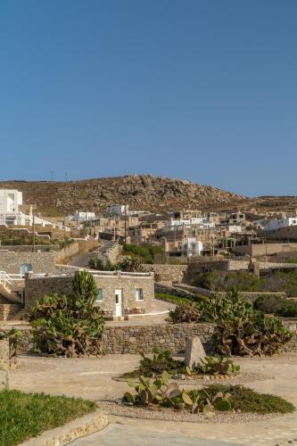 a view of a city with buildings in the background at Sofia's Bungalows Mykonos in Mýkonos City