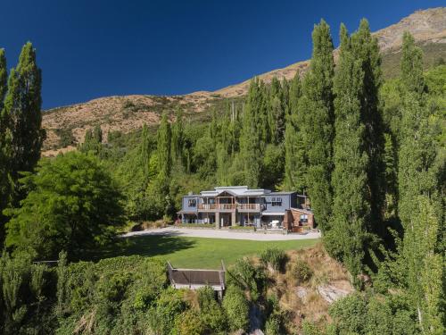 an aerial view of a large house with trees at Moonlight Escape Lodge in Queenstown