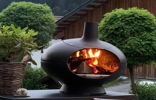 a fire oven sitting on top of a table at Ferienwohnungen Monika Winter in Kleinarl