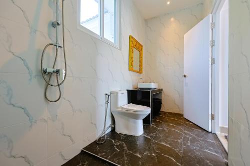 a bathroom with a toilet and a shower at Thala Villa Koh Samui in Nathon Bay