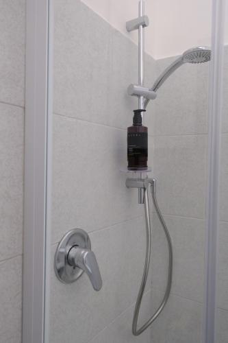 a shower with a shower head in a bathroom at Casa Maggiolino by PortofinoVacanze in Rapallo
