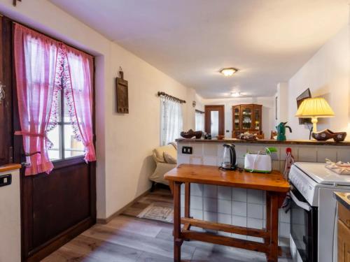 a kitchen with a table and a counter top at da Adri ed Eli in Anzino