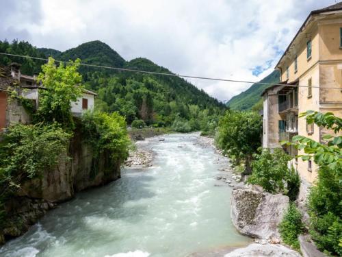 a river flowing through a town with buildings at da Adri ed Eli in Anzino