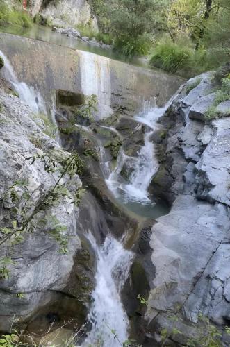 a waterfall on the side of a river at Στη γοητεία του Ολύμπου in Litochoro