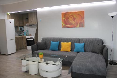 a living room with a couch and a table at Apartment Patra Greece in Patra