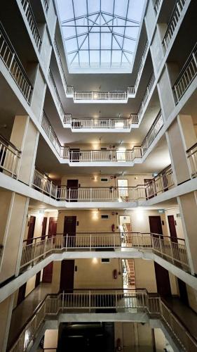 a large building with a large skylight in the ceiling at One Deves in Bangkok