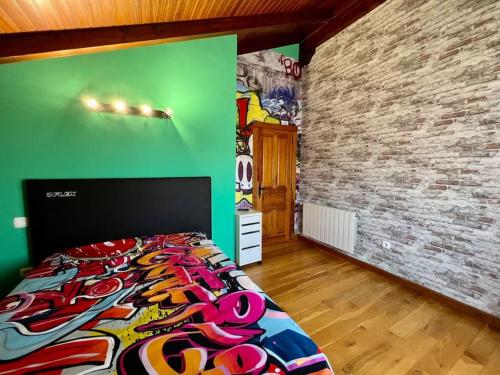 a bedroom with a bed and a green wall at Secret Paradise, Stylish Host in Camargo