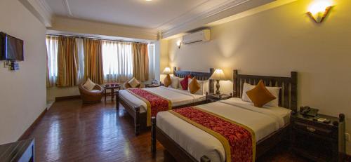 Postel nebo postele na pokoji v ubytování Hotel Holy Himalaya
