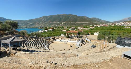 an amphitheater with a view of a town and mountains at Verdelis Inn in Ancient Epidavros