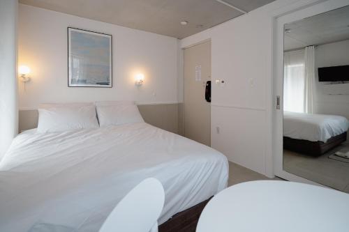 The Phase Boutique Hotel 동대문にあるベッド
