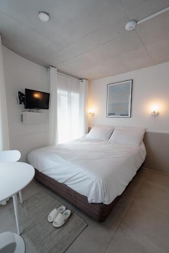 The Phase Boutique Hotel 동대문にあるベッド