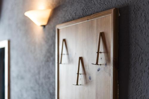a mirror with the letters ra on a wall at CHALET DES ALPES in Gressan