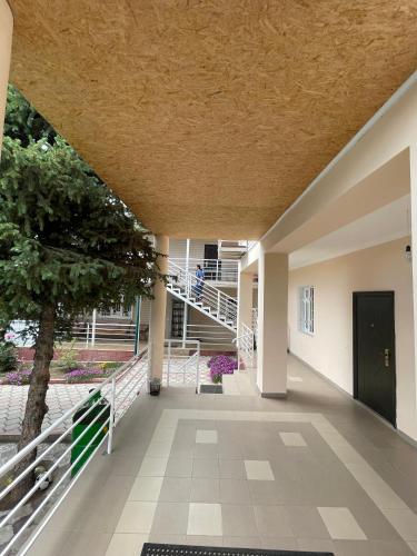 an empty hallway of a building with a staircase at Отель на берегу in Bosteri