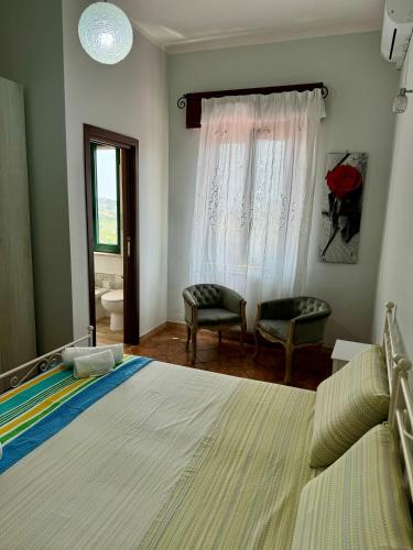 Ένα ή περισσότερα κρεβάτια σε δωμάτιο στο Agriturismo Le Macine-Poggio Cono