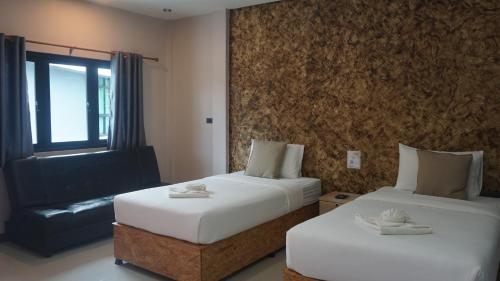 Katil atau katil-katil dalam bilik di Farinda Resort