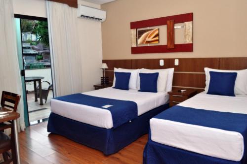 Ένα ή περισσότερα κρεβάτια σε δωμάτιο στο Hotel Arlen 4
