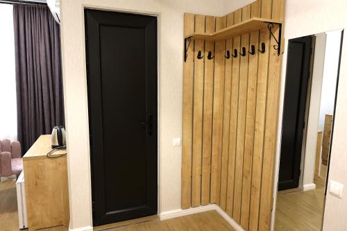 a room with a black door in a room at Greenwood in Borjomi